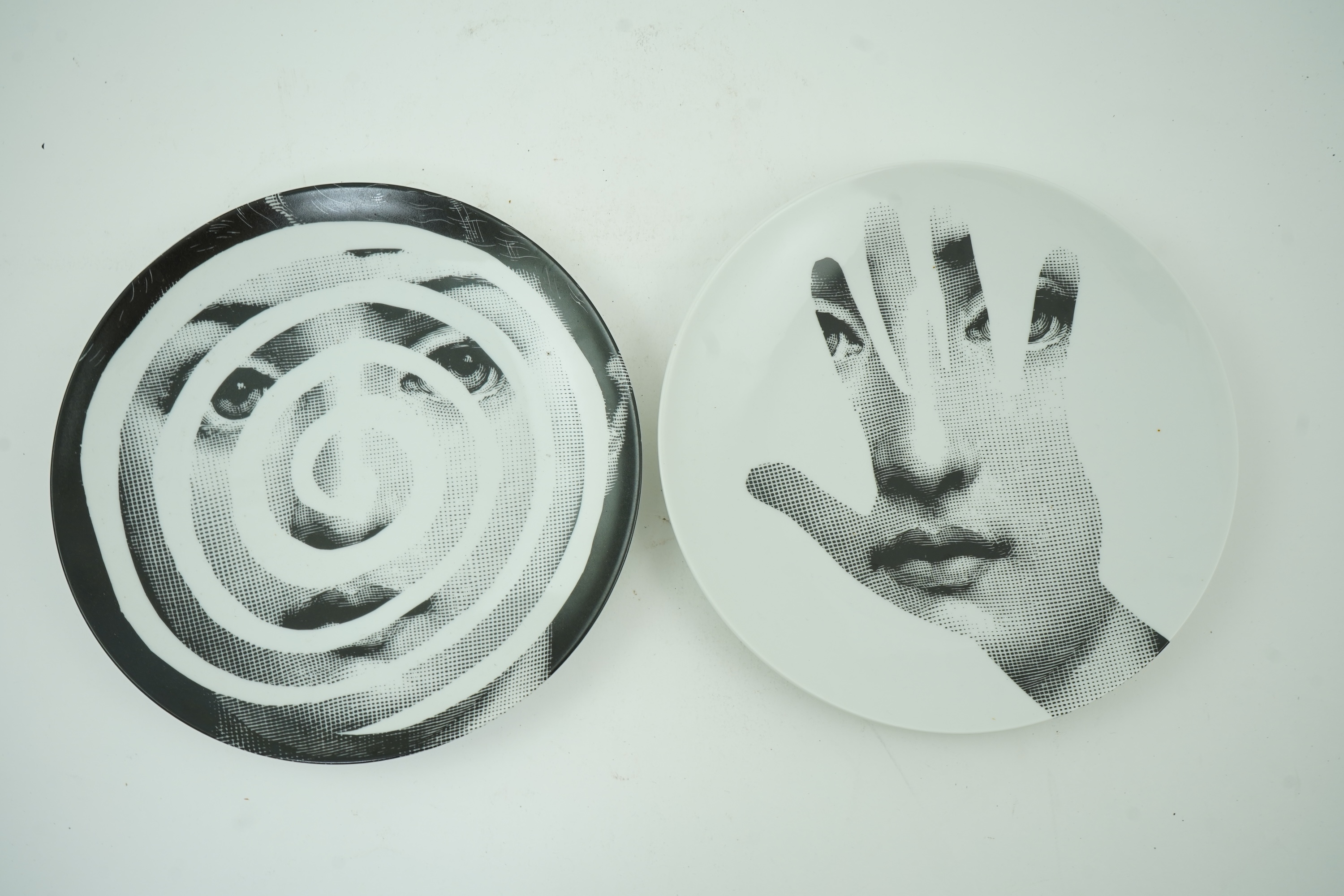 Piero Fornasetti (Italian, 1913-1988): Two 'Tema a Variazioni' plates